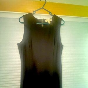 Black sleeveless leather bottom dress with tags.  Back is long zipper.